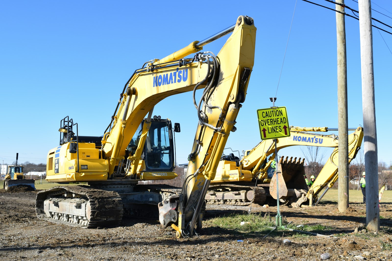 NRX Asphalt excavators on a construction site with safety protocols in place